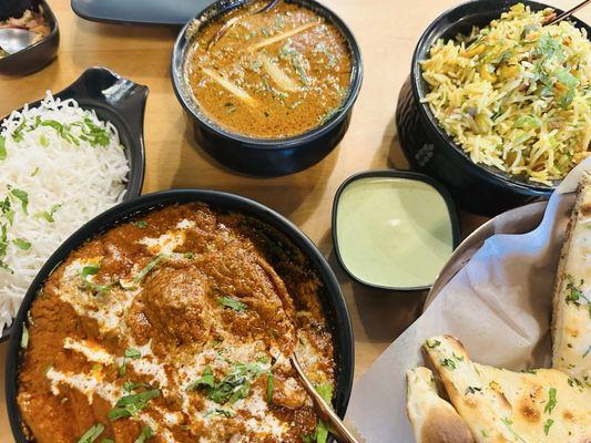 veggie biryani, goat hyderabadi curry, chicken tika masala, garlic butter naan (white rice comes complimentary)