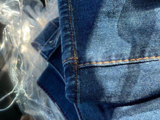 What purports to be original hemming and it's not even aligned.