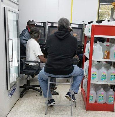 Why these guys are sitting around blocking up the aisle ways I have no idea.