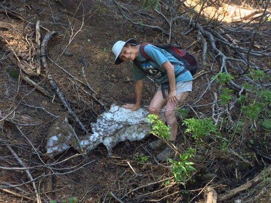 Margaret & a chunk of snow from one of her morning hikes near camp (photo by Chad T.), Folk Dance 2019
