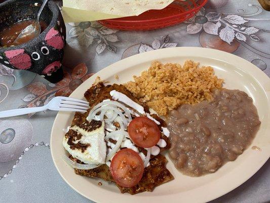 Chilaquiles with red sauce, rice and beans. Their salsa and chips are good