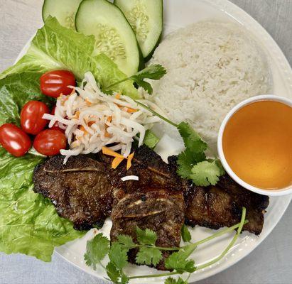 "Enjoy a flavorful Galbi rice dish featuring fragrant lemongrass-infused tender Angus short ribs grilled to a smoky barbecue perfection