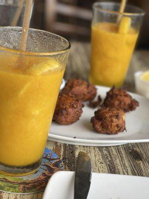 Conch fritters and frozen mango lemonade (no alcohol).