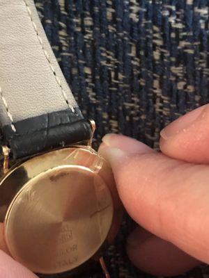 Scratched the 14kt gold backing of the watch. I also have photos taken yesterday for watch appraisal, and these scratches weren't there.