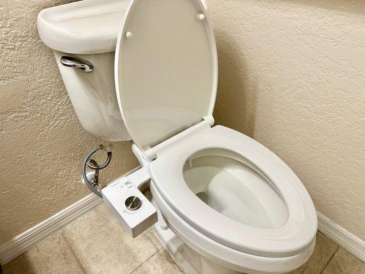 Installation of bidet attachment to existing toilet.