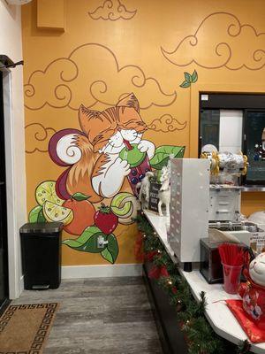 Cute boba cat wall art by the front counter!