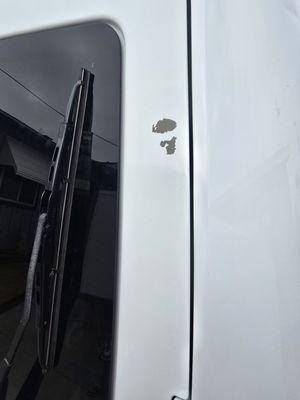 Paint missing due to pulling off masking tape