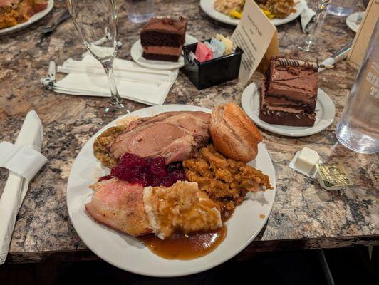 Dinner buffet had turkey, ham, roast beef, stuffing cranberry sauce. Chocolate cake was already on the table