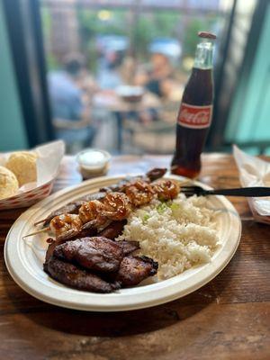 Skewer shrimp and steak, white rice and fried bananas platter