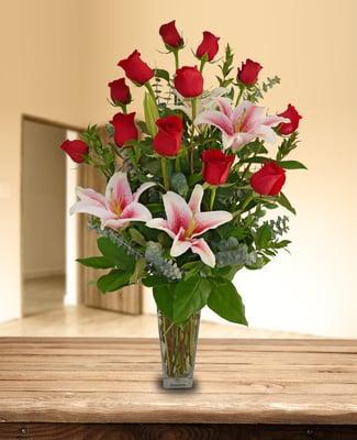 IBE318 Premium Roses - One dozen red roses beautifully arranged with fragrant stargazer lilies.
