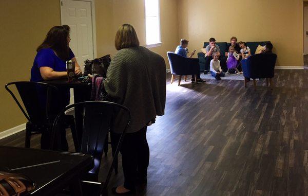A few of our parents and kids hanging out in our fellowship hall