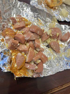 Sausage (hot dogs), potato and cheese. There was not any egg either.