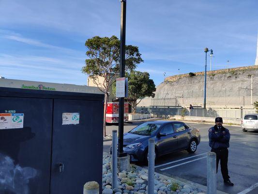 They do have a sign, but it's not clearly visible from most parking spots. It's obscured from view by electrical equipment.