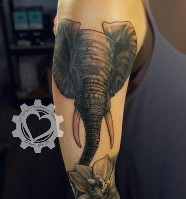 Black and grey elephant tattoo