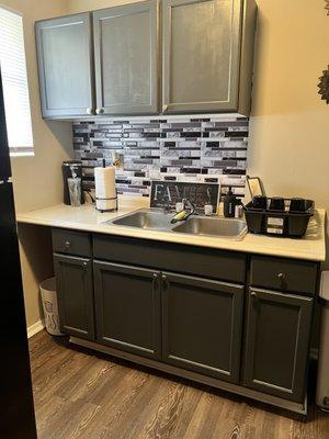 Kitchen I added my own back splash in painted the cabinets to give it a upgraded look on a budget.