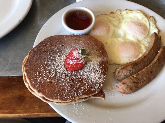 2x2x2 breakfast except my wife wanted an extra egg. It consists of multigrain pancake, chicken sausage and overeasy eggs.