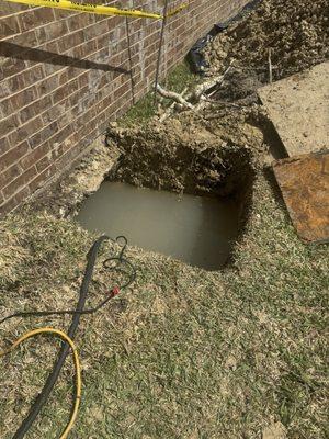 15ft hole dug to fix leak under house