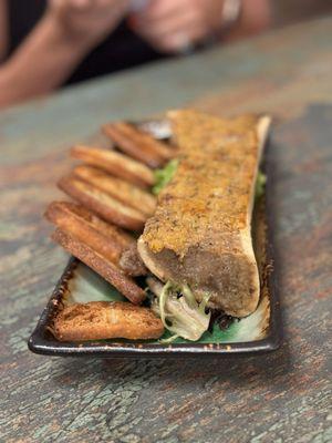 Roasted bone marrow- spread on Toasted baguettes. Rich and savory