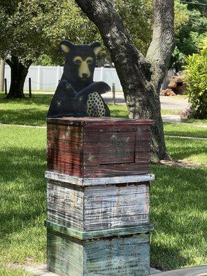 The garbage can was decorated to match the mural Lost Bear Cub.