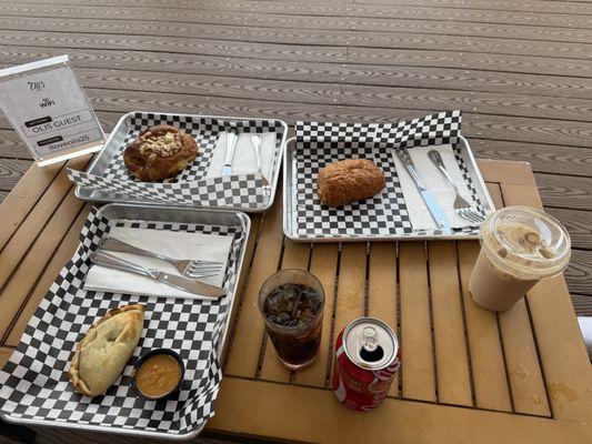 Chicken Mole Empaña, chocolate croissant, ham croissant, coke, iced vanilla latte.