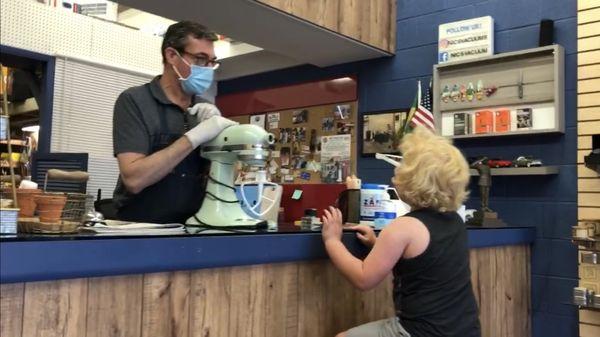 John makes time for his customers - even when they're 5.