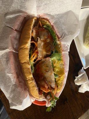 Bahn mi with roasted pork, Vietnamese ham, pork pate, and pork loaf.