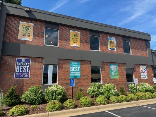 A few of Dahl Consulting's accolades displayed on our office building.