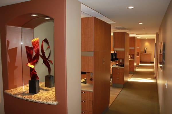 Beautifully designed office with natural light and an expanding collection of art, reflecting the charm of Laguna Beach.