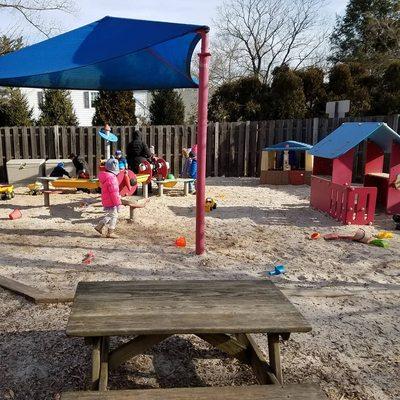 Swings, climbing structure, slides, and our large sandbox make for a very fun time playing with friends on the playground!