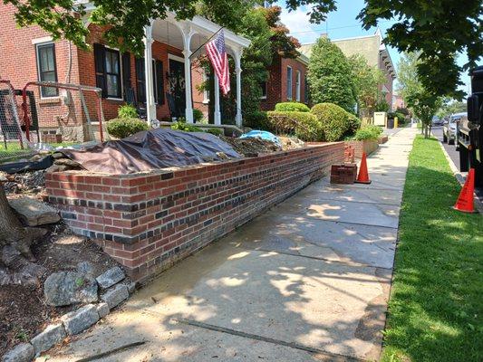Added 4 courses of brick to existing wall that is approximately 30 years old or more.