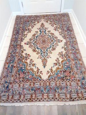 Same rug before cleaning, showing 46 years of dirt and grime.