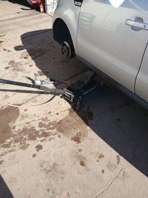 Picking up a used tire for the Kia.