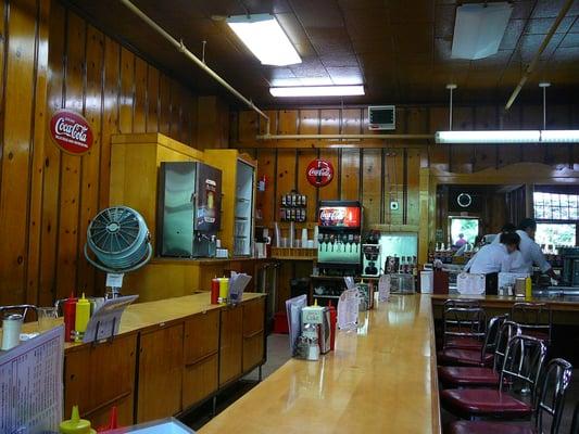 Diner seating inside the Caves Cafe
