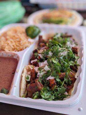 Taco plate: carnitas, chorizo, Al pastor