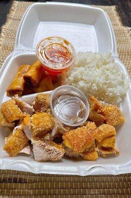 Pork lechon option with lumpia and rice