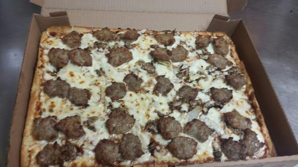 This is a sausage mushroom onion pizza I ordered. I asked them not to cut it so I could just cut it at home. What a beauty!