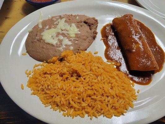 Chicken enchilada with rice and beans. The enchilada was quite bland.