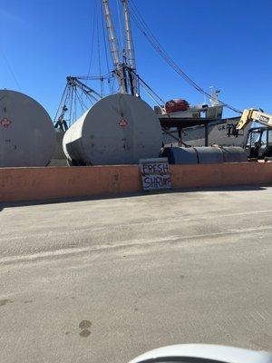 Pink sea wall. Look left when you reach it.