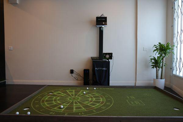 High-tech putting green from Puttview. Improve your putting game through pro-level drills, interactive games, and putting training aids.