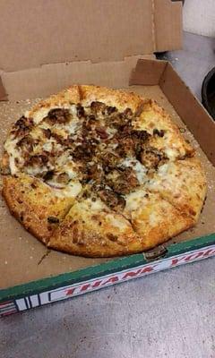 Eating a delicious pizza at Stop n Go deli, a hidden gem in the back of a carryout/gas station!