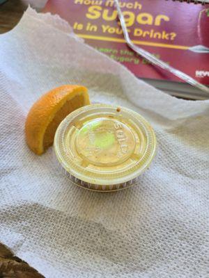 "Coldshot" (turmeric, garlic, ginger, lemon, lime, & an orange slice on the side) 