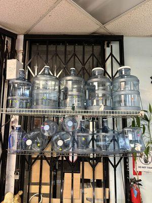 Different kind of empty water jugs for sale
