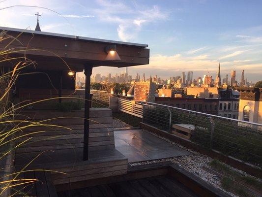 Create a shaded outdoor kitchen and living room. This solar canopy (on the left) has custom cedar and IPE wood furniture