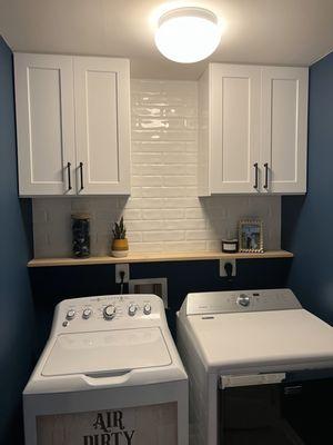 Laundry room - they put in the cabinets and tiled. It helped make a boring space be something I want to be in and look at all the time!