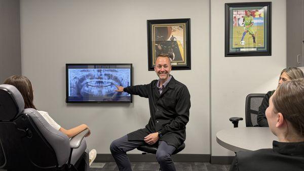 Dr. Lowe explaining treatment in a new patient exam.