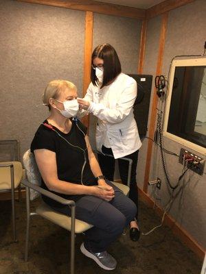Adult hearing testing in a sound proof booth