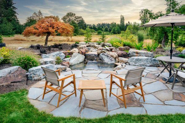 Breathtaking, peaceful flagstone patio, bolder waterfall and pond.