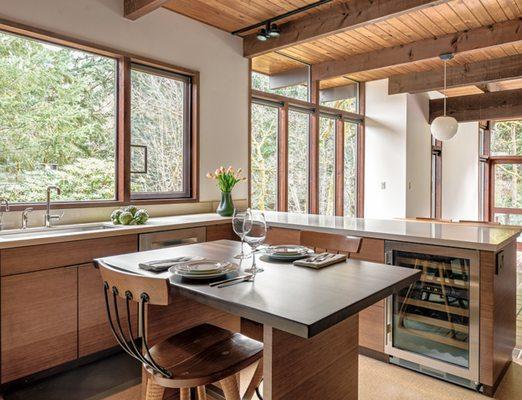Remodeling this '50 home allowed us to open up the kitchen and drastically improve the lighting and function of the kitchen.