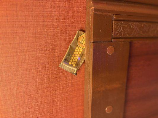 Honey pack stuffed behind the bed headboard