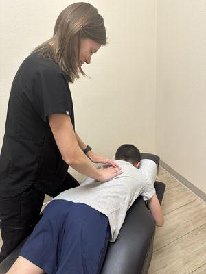 Special needs son willingly laying down and allowing Dr Cramer to touch him.